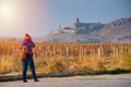 Asian backpacker traveler woman in winter suit hand hold camera standing at The Khor Virap,Armenia monastery