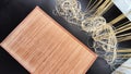 Asian bamboo mat and napkin from yellow bamboo on black surface. Background, texture, frame, copy space, location for Royalty Free Stock Photo