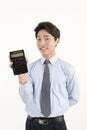 Asian bank teller with a calculator Royalty Free Stock Photo