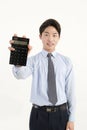 Asian bank teller with a calculator Royalty Free Stock Photo