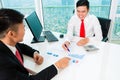 Asian banker counseling financial investment