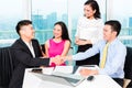 Asian banker team counseling couple in office