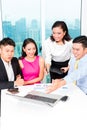 Asian banker team counseling couple in office