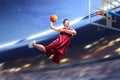 Asian basketball player man jumps in the air with the ball trying to score Royalty Free Stock Photo