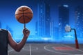 Asian male basketball player spin a ball on night city Royalty Free Stock Photo