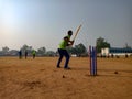 Asian batsmen hitting shot during cricket match on ground in India January 2020 Royalty Free Stock Photo