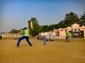 Asian batsmen hitting shot during cricket match on ground in India January 2020 Royalty Free Stock Photo