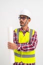 Asian bearded contractor with safety helmet on head in vest standing with arms crossed on white background. Construction