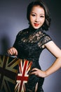 Asian beauties wear cheongsam and carry suitcases. A happy smile. Royalty Free Stock Photo