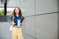 Business woman confident smiling with cloth bag holding steel thermos tumbler mug water glass Royalty Free Stock Photo