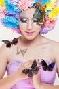 Asian Beautiful Girl With colorful make up with fresh Chrysanthemum Flowers and Butterfly Royalty Free Stock Photo