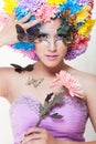 Asian Beautiful Girl With colorful make up with fresh Chrysanthemum Flowers and Butterfly Royalty Free Stock Photo