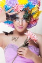 Asian Beautiful Girl With colorful make up with fresh Chrysanthemum Flowers and Butterfly Royalty Free Stock Photo