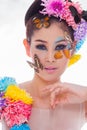 Asian Beautiful Girl With colorful make up with fresh Flowers and Butterfly Royalty Free Stock Photo
