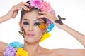 Asian Beautiful Girl With colorful make up with fresh Flowers and Butterfly Royalty Free Stock Photo