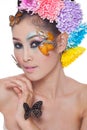 Asian Beautiful Girl With colorful make up with fresh Flowers and Butterfly Royalty Free Stock Photo