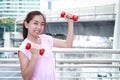 Beautiful girl holding a dumbbell Royalty Free Stock Photo
