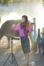 An Asian beautiful girl playing a violin Royalty Free Stock Photo