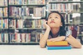 Asian beautiful girl thinking idea and reading books for education Royalty Free Stock Photo