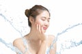 Asian Beautiful model. Beautiful Smiling girl under splash of water with fresh skin on white background Royalty Free Stock Photo