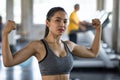 woman showing arm muscle in gym Royalty Free Stock Photo
