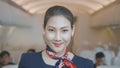 Asian beautiful woman cabin crew is smiling onboard , safety travel , relaxation tourism concept