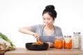 Asian beautiful woman Cooking kimchi Is a Korean fermented food made from vegetables Royalty Free Stock Photo