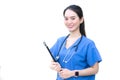 Asian beautiful woman doctor standing smiling in a blue lab shirt, holding patient documents in hand. Health care concept Royalty Free Stock Photo