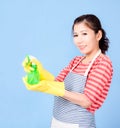 Asian beautiful woman holding a bottle spray  to clean the device and smiling happily to clean the house Royalty Free Stock Photo