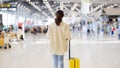 Asian beautiful woman with luggage and walking in airport Royalty Free Stock Photo