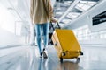 Asian beautiful woman with luggage and walking in airport Royalty Free Stock Photo