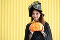 A woman dressed as a witch at Halloween party