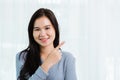 Asian beautiful woman smiling face long hair stand pointing finger to side away Royalty Free Stock Photo