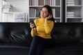 asian beautiful woman smiling at home in headphones listen music at home. Use technology, lifestyle concept Royalty Free Stock Photo