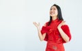 Asian beautiful woman wearing red dress or qipao, smiling with happiness, celebrate Chinese New year, standing on white background
