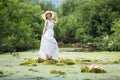 Asian beautiful women wearing white dress in the forest on the c Royalty Free Stock Photo