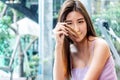 Asian beautiful young woman hand holding her long hair with looking damaged split ends of hair. Hair loss problem and Hair Royalty Free Stock Photo