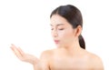 Asian beautiful young woman showing with healthy clean skin presenting something empty copy space on the hand isolated Royalty Free Stock Photo