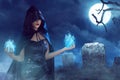 Asian beauty witch woman with blue fire on her hand Royalty Free Stock Photo