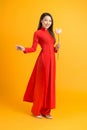 Asian beauty woman. Beautiful happy Vietnamese girl wearing national traditional red ao dai dress Royalty Free Stock Photo