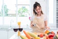Asian beauty woman cooking and slicing vegetable in kitchen room
