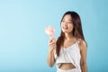 Asian beauty young woman holding pink portable electric mini fan near her face Royalty Free Stock Photo