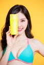 Asian bikini girl take sunscreen Royalty Free Stock Photo