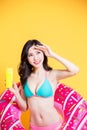 Asian bikini girl take sunscreen Royalty Free Stock Photo