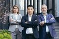 Asian boss with team, portrait of group of people with crossed arms looking at camera Royalty Free Stock Photo