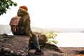 Asian boy sitting on park winter season Royalty Free Stock Photo