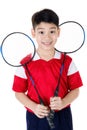 Asian boy in badminton action Royalty Free Stock Photo