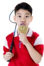 Asian boy in badminton action Royalty Free Stock Photo