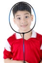 Asian boy in badminton action Royalty Free Stock Photo