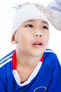 Asian boy in blue sportswear with trauma of the head. Royalty Free Stock Photo